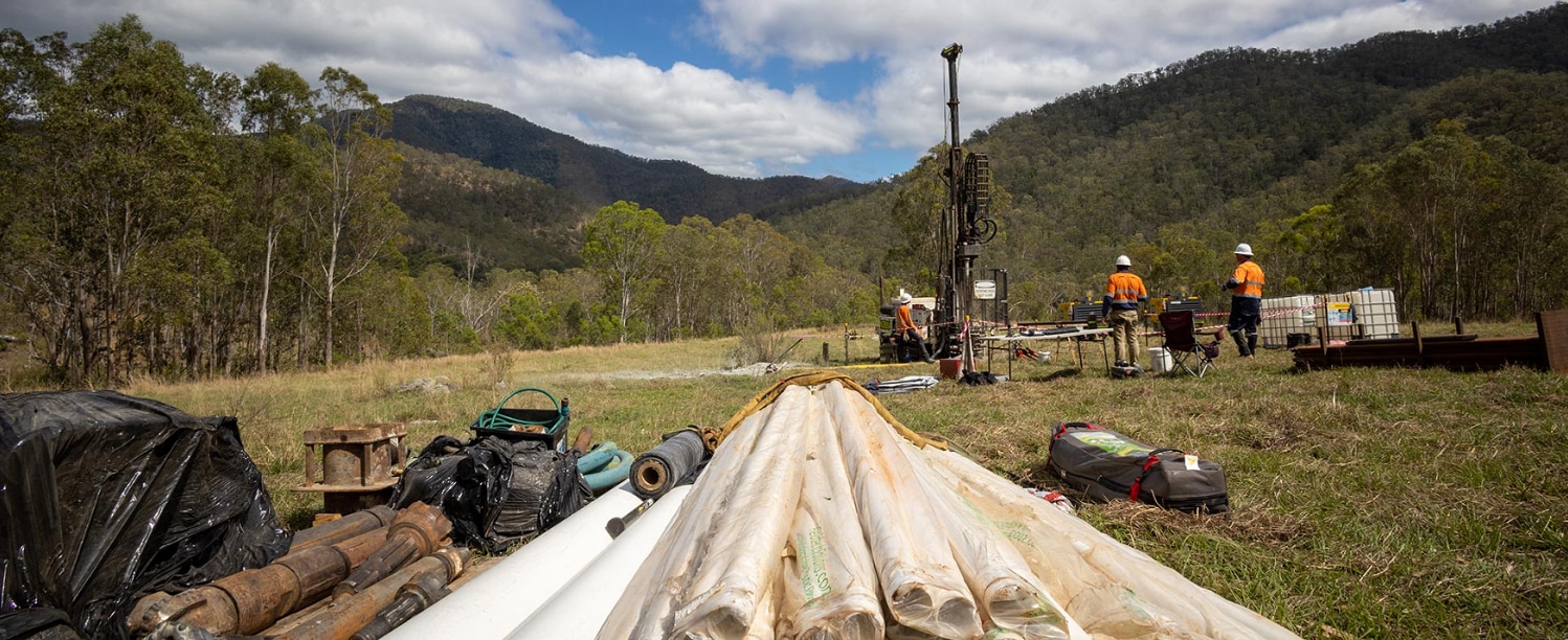 An image of several workers in hi-vis collecting ground samples in the OMPS project area.